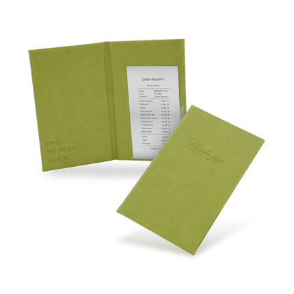 A green bill binder with a menu partially visible, closed and open, with a visible logo on the front cover.