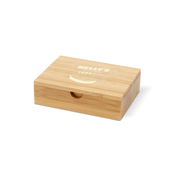 A bamboo bill box with white nelly's logo printed on the top