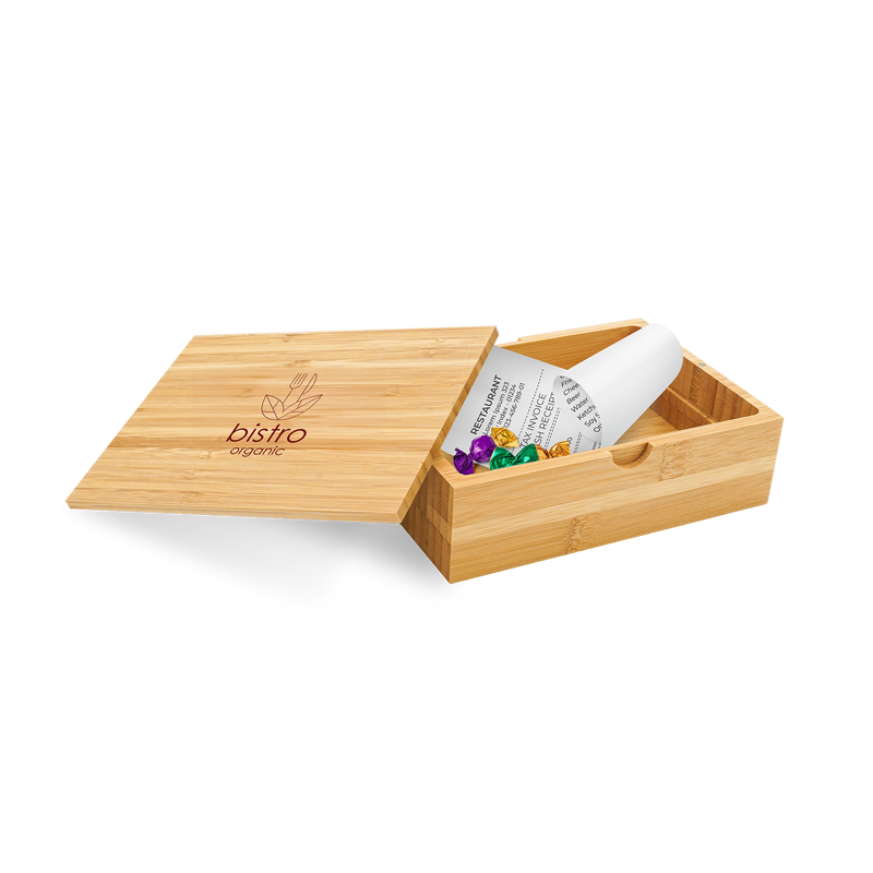 A bamboo bill box with a lid, partially open, displaying a white card with the brand 'Bistro' printed on it, and containing some colorful buttons or candies.