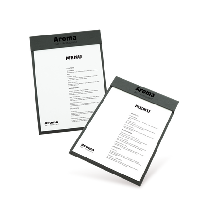 Two clipboards with grey edges and white menu sheets, one with 'COCKTAILS' and the other with 'MENU' written at the top, both lying at an angle.