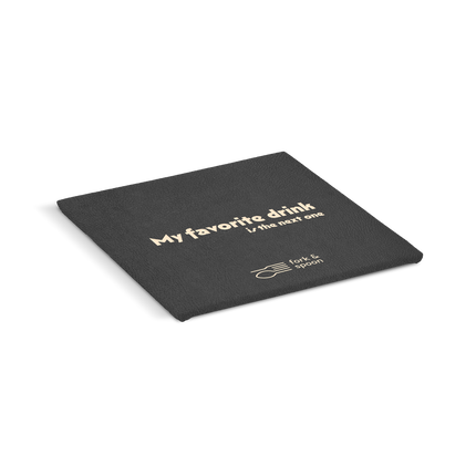 An black square coaster with the text 'My favorite drink' and a logo on it.