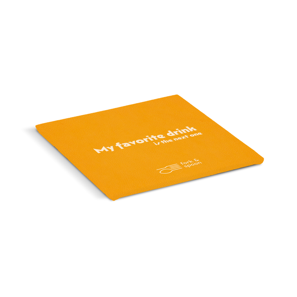 An orange square coaster with the text 'My favorite drink' and a logo on it.