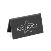 A black reserved sign with a white star and the word 'RESERVED' printed on it.