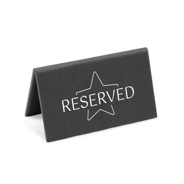 A black reserved sign with a white star and the word 'RESERVED' printed on it.