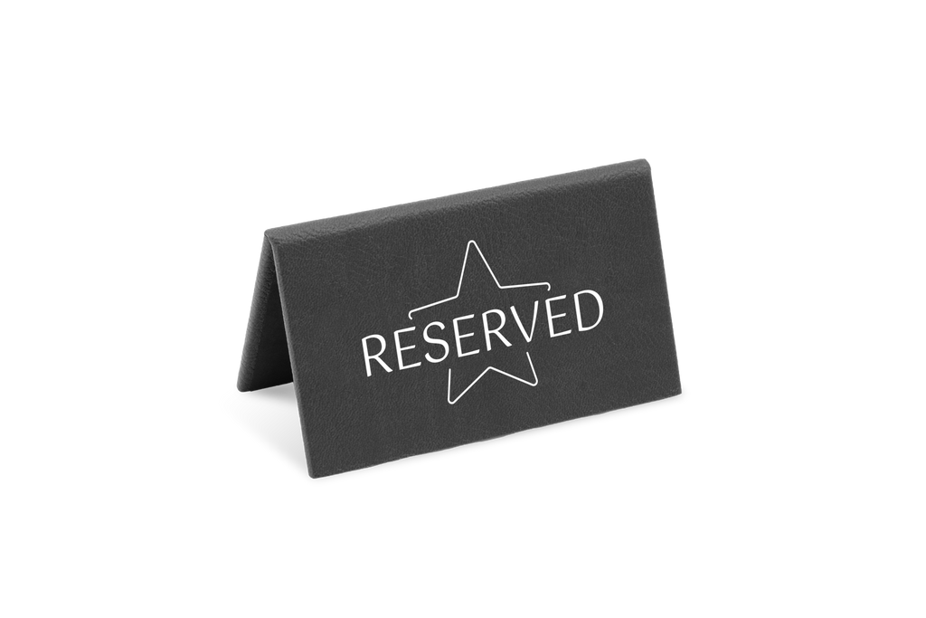 A black reserved sign with a white star and the word 'RESERVED' printed on it.