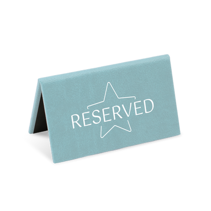 A blue reserved sign with a white star and the word 'RESERVED' printed on it.