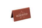 A brown reserved sign with a white star and the word 'RESERVED' printed on it.
