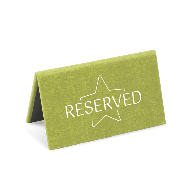A green reserved sign with a white star and the word 'RESERVED' printed on it.