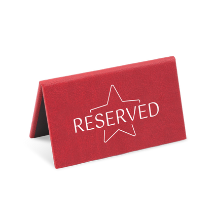 A red reserved sign with a white star and the word 'RESERVED' printed on it.