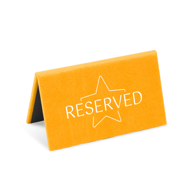 A orange reserved sign with a white star and the word 'RESERVED' printed on it.