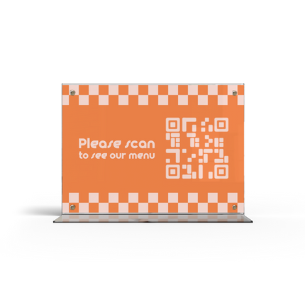 A acrylic menu stand with a transparent side showing a menu card inside.